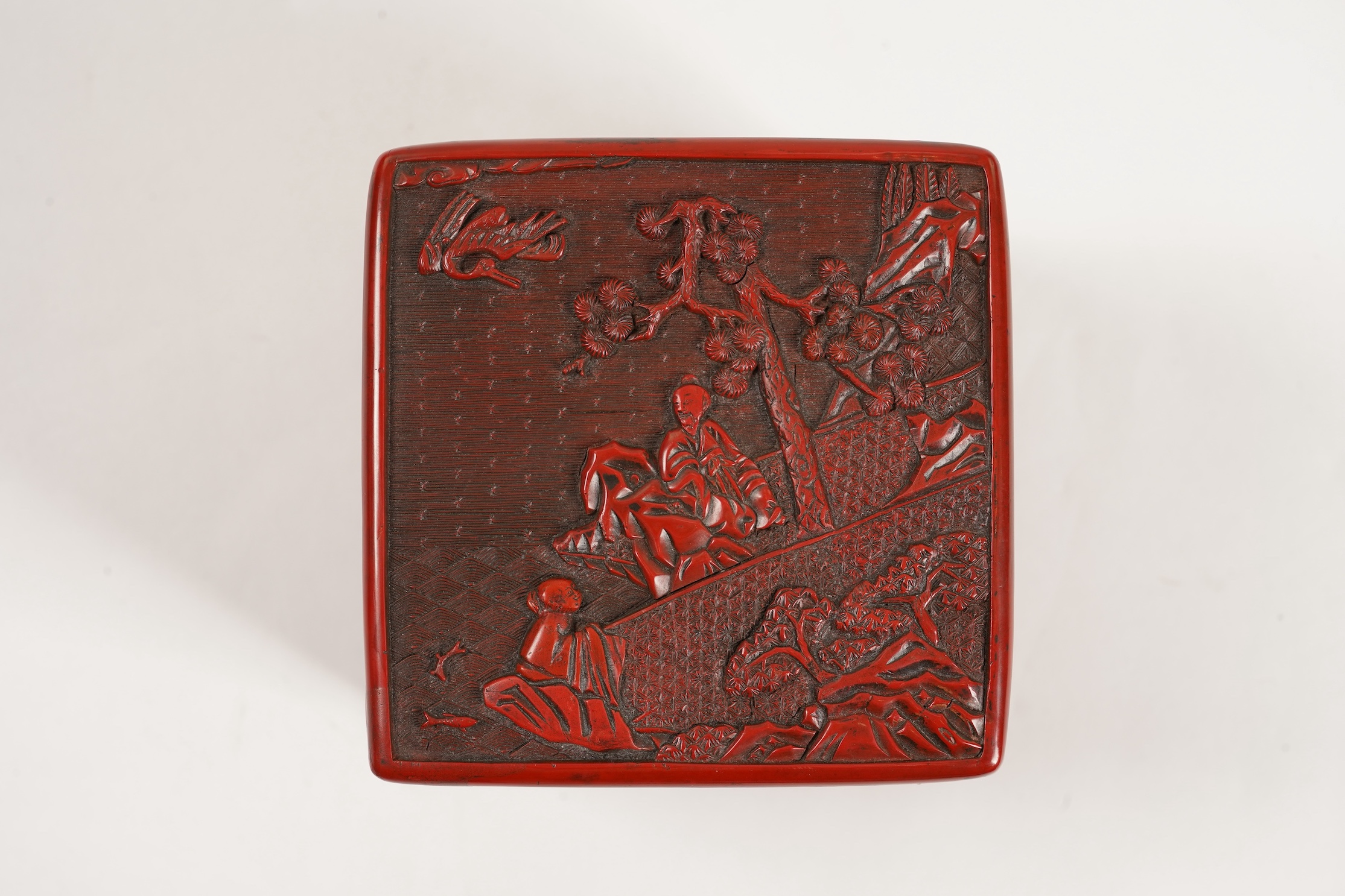 A Chinese Ming cinnabar lacquer four tier box, 15th century